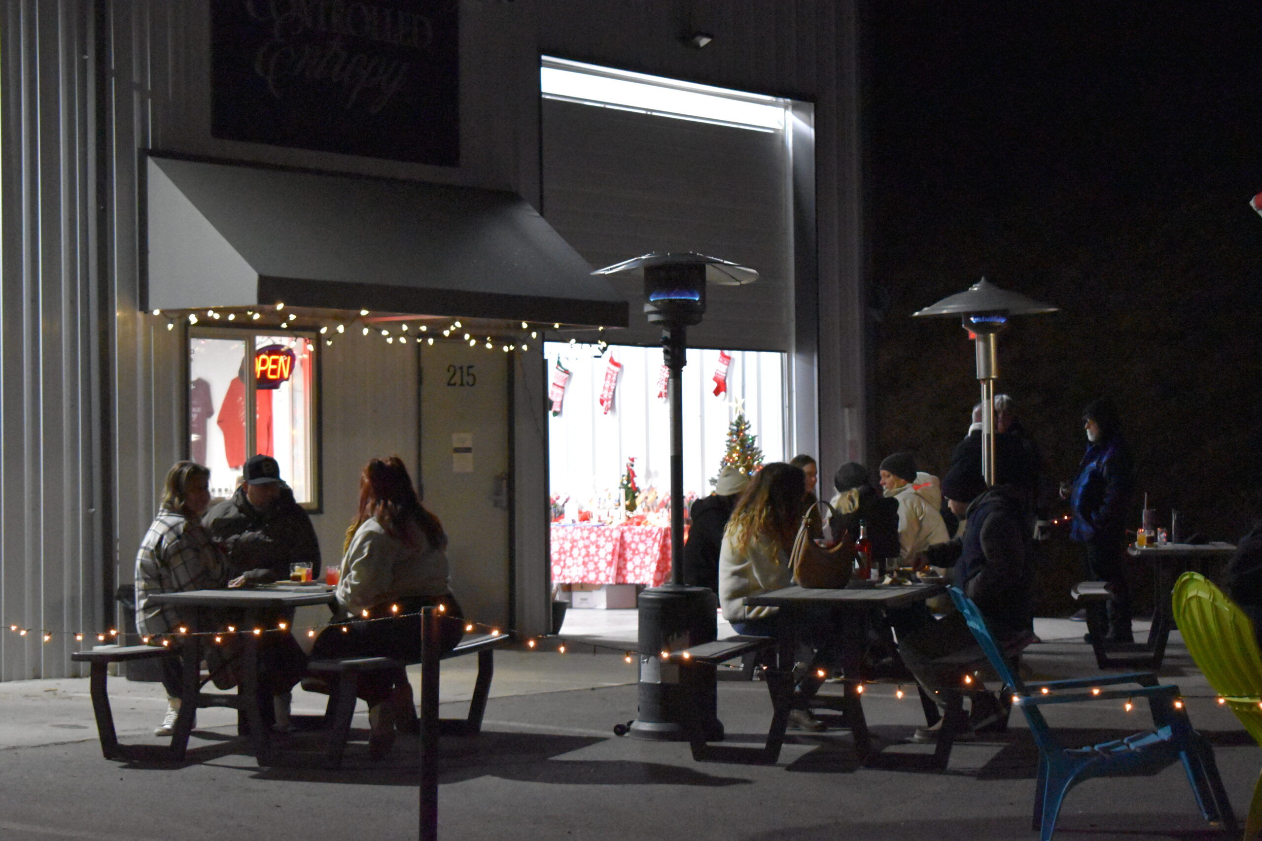 A full patio at Controlled Entropy's Light up the Vines patio